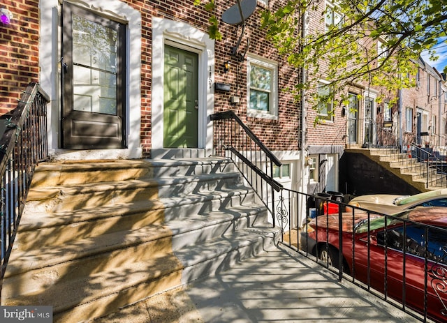 exterior space with brick siding
