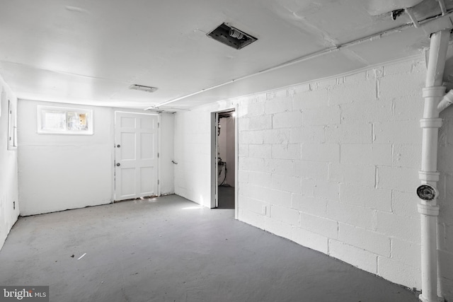 basement with visible vents and concrete block wall