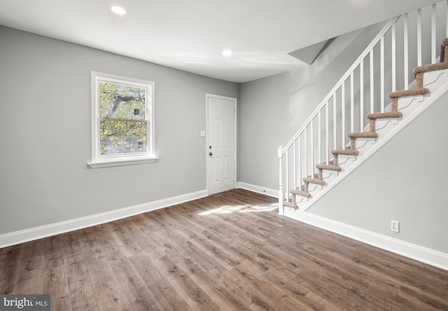 foyer entrance featuring baseboards, recessed lighting, and wood finished floors