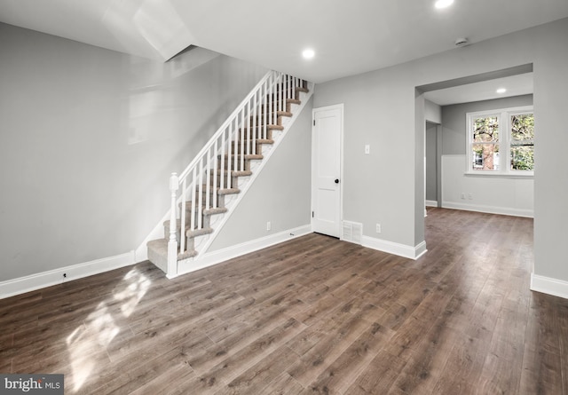 interior space with visible vents, wood finished floors, stairs, and recessed lighting