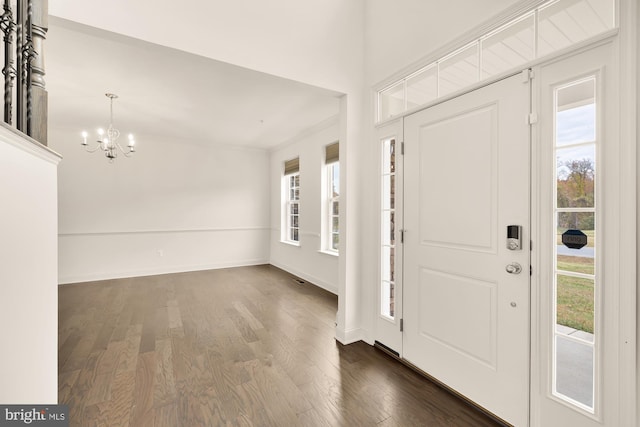 11108 King Gallahan Ct, Clinton, MD 20735 - foyer featuring dark wood-style floors, baseboards, and a notable chandelier