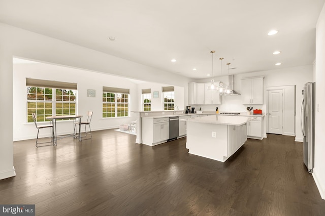11108 King Gallahan Ct, Clinton, MD 20735 - kitchen featuring recessed lighting, a kitchen island, wall chimney range hood, light countertops, and appliances with stainless steel finishes