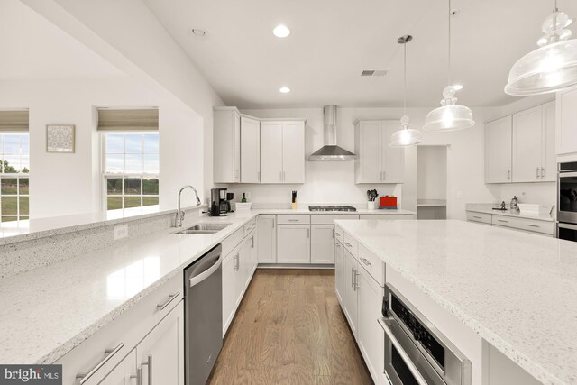 11108 King Gallahan Ct, Clinton, MD 20735 - kitchen featuring light wood-style flooring, a sink, dishwasher, recessed lighting, and wall chimney exhaust hood