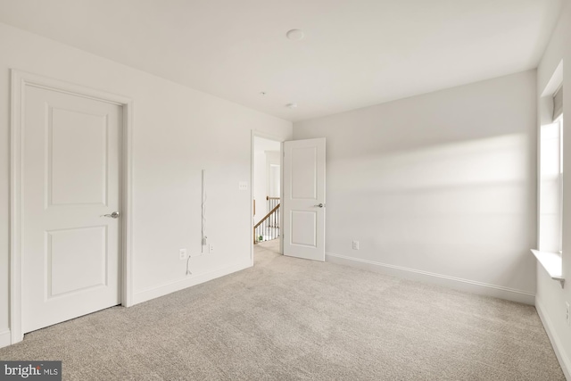 11108 King Gallahan Ct, Clinton, MD 20735 - unfurnished bedroom with baseboards and light colored carpet