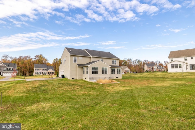 11108 King Gallahan Ct, Clinton, MD 20735 - back of property featuring a lawn, driveway, crawl space, and a garage