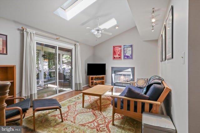 1602 Blacksmith Ln, Herndon, VA 20170 - living room with a skylight, lofted ceiling, wood finished floors, and a ceiling fan