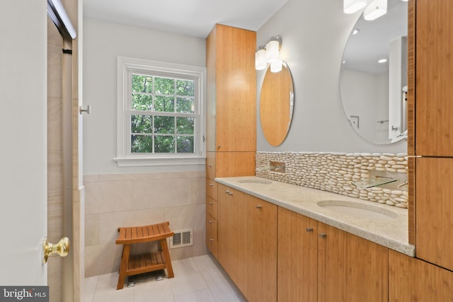 1602 Blacksmith Ln, Herndon, VA 20170 - bathroom featuring tile patterned flooring, tile walls, and double vanity
