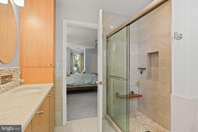 1602 Blacksmith Ln, Herndon, VA 20170 - ensuite bathroom featuring a ceiling fan, a shower stall, tile patterned flooring, and vanity