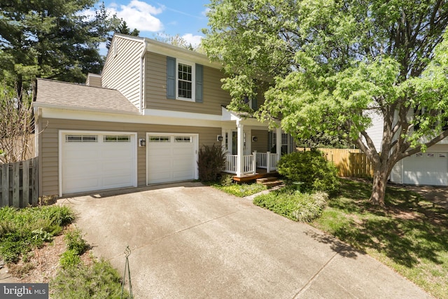 1602 Blacksmith Ln, Herndon, VA 20170 - view of front facade featuring covered porch, driveway, and an attached garage