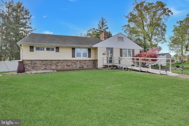 view of front of property featuring a chimney, roof with shingles, and a front lawn