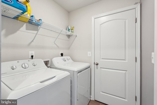 17026 Rollins Rd, Bowling Green, VA 22427 - laundry area featuring separate washer and dryer, laundry area, and wood finished floors