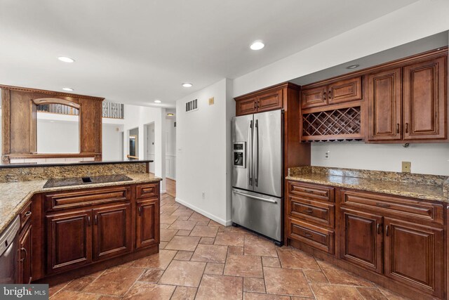 kitchen with visible vents, stainless steel fridge with ice dispenser, stone tile flooring, black electric stovetop, and recessed lighting