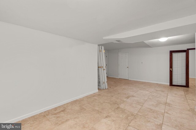 finished basement featuring baseboards