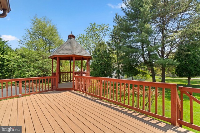 deck featuring a yard and a gazebo