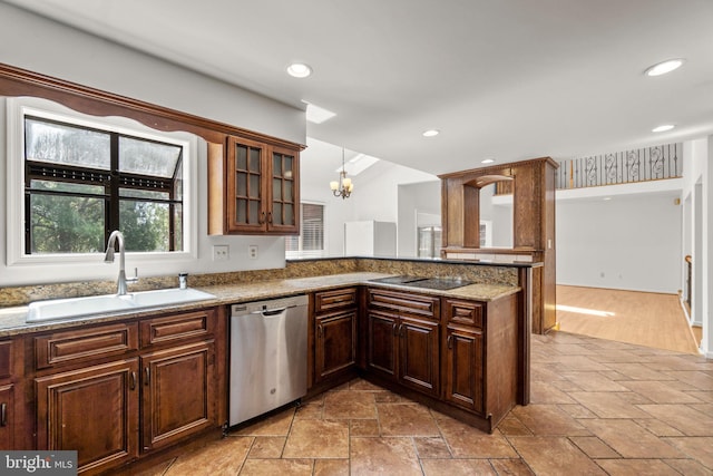 kitchen with a sink, dishwasher, a chandelier, glass insert cabinets, and stone tile flooring