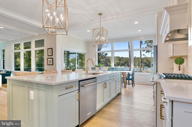 1634 Orchard Beach Rd, Annapolis, MD 21409 - kitchen featuring a sink, a notable chandelier, stainless steel appliances, and light wood-type flooring