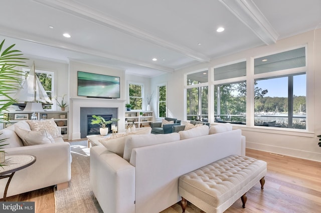 1634 Orchard Beach Rd, Annapolis, MD 21409 - living area with beam ceiling, recessed lighting, wood finished floors, and a glass covered fireplace
