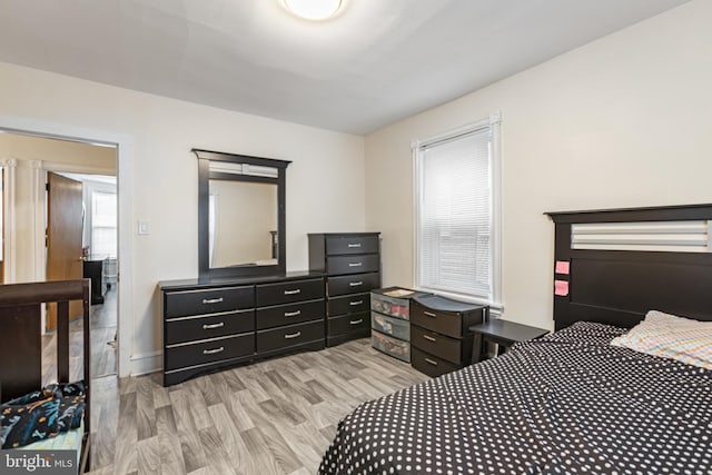 bedroom with light wood-style flooring