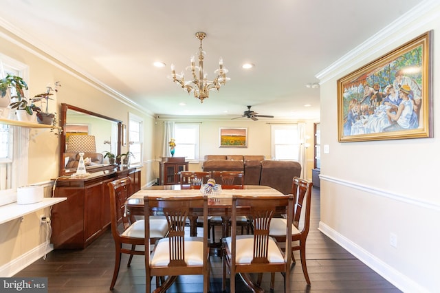 dining room featuring crown molding, dark wood-style floors, and ceiling fan with notable chandelier