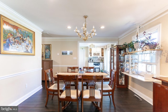 dining space with an inviting chandelier, crown molding, and dark wood-style floors