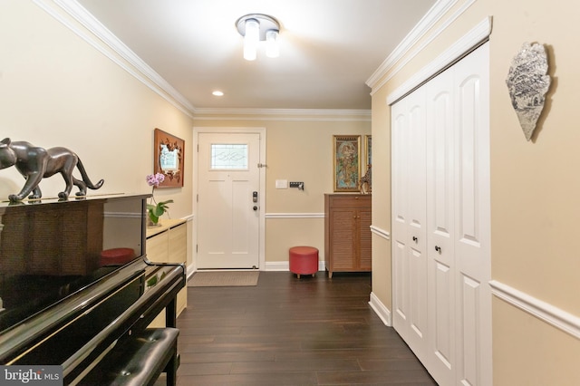 foyer with crown molding, recessed lighting, baseboards, and dark wood finished floors