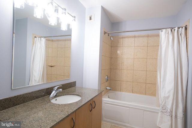 full bath featuring visible vents, shower / tub combo, and vanity