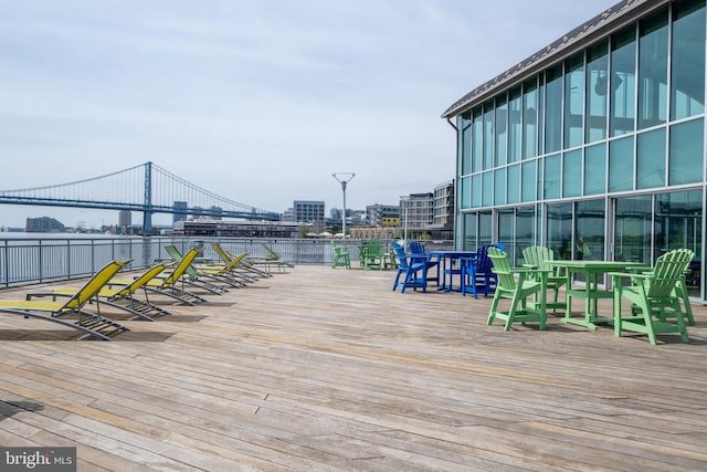 wooden deck featuring outdoor dining area