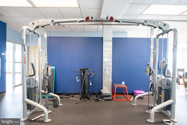 gym featuring a paneled ceiling