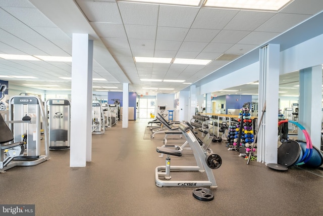 exercise room with a drop ceiling