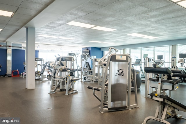 exercise room featuring a paneled ceiling