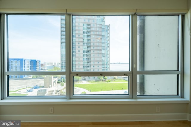 room details featuring a view of city and baseboards