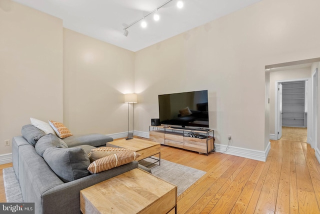 914 Spruce St Unit 9, Philadelphia, PA 19107 - living area with light wood finished floors, track lighting, and baseboards