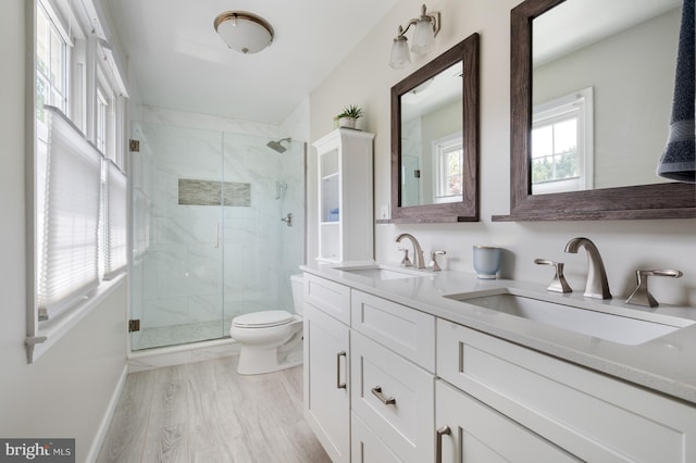 5433 Lomax Way, Woodbridge, VA 22193 - bathroom featuring toilet, a shower stall, double vanity, and wood finished floors