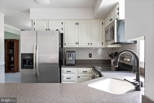 5433 Lomax Way, Woodbridge, VA 22193 - kitchen with stainless steel appliances, white cabinetry, decorative backsplash, a sink, and crown molding