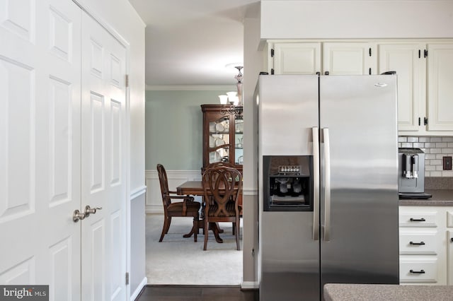 5433 Lomax Way, Woodbridge, VA 22193 - kitchen with stainless steel refrigerator with ice dispenser, ornamental molding, decorative backsplash, white cabinetry, and wainscoting