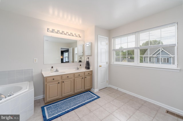 7815 Outing Ave, Pasadena, MD 21122 - full bath with double vanity, a garden tub, baseboards, and tile patterned flooring