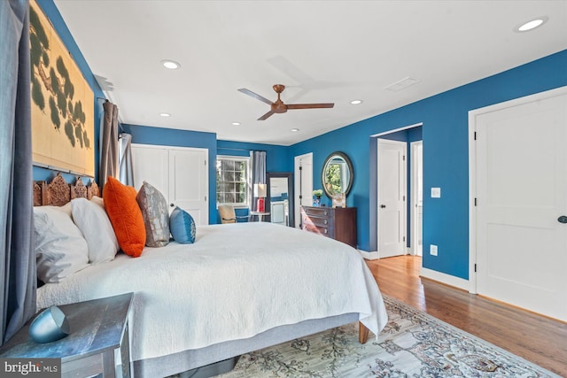 4812 Maury Ln, Alexandria, VA 22304 - bedroom with multiple closets, wood finished floors, baseboards, ceiling fan, and recessed lighting
