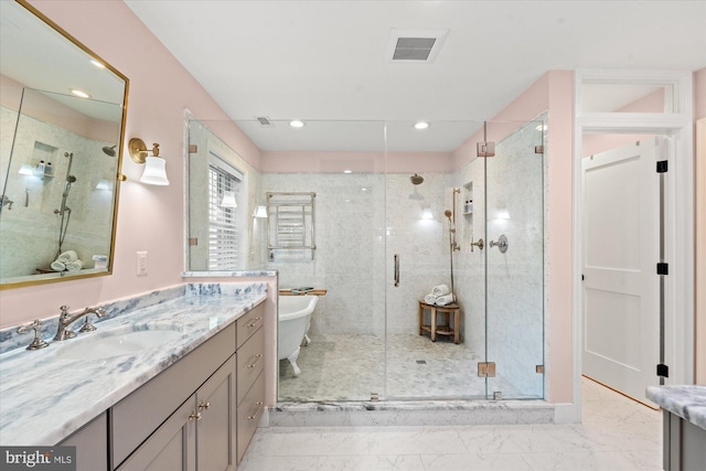 4812 Maury Ln, Alexandria, VA 22304 - bathroom featuring a freestanding bath, vanity, marble finish floor, visible vents, and a stall shower