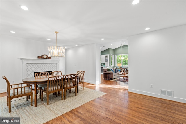 4812 Maury Ln, Alexandria, VA 22304 - dining area with visible vents, recessed lighting, wood finished floors, and vaulted ceiling