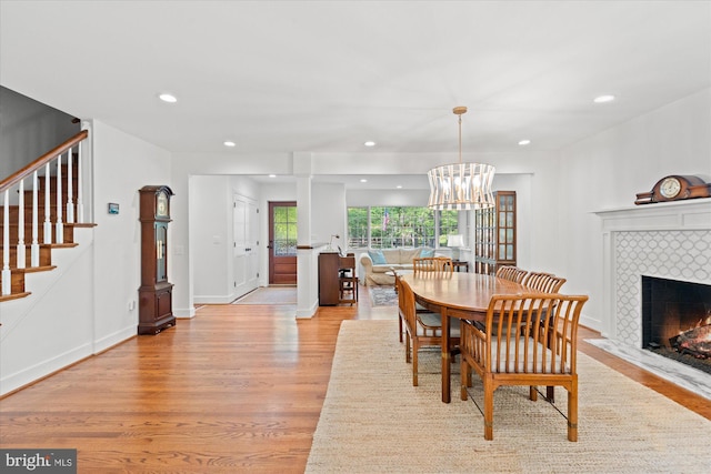 4812 Maury Ln, Alexandria, VA 22304 - dining space with stairs, recessed lighting, light wood-style flooring, and a tile fireplace