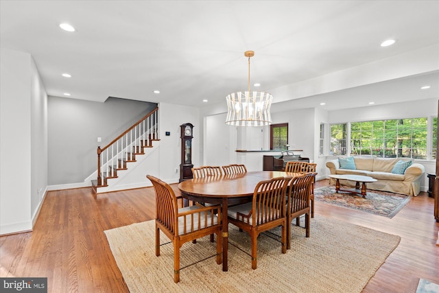 4812 Maury Ln, Alexandria, VA 22304 - dining room with recessed lighting, an inviting chandelier, stairway, and light wood-type flooring