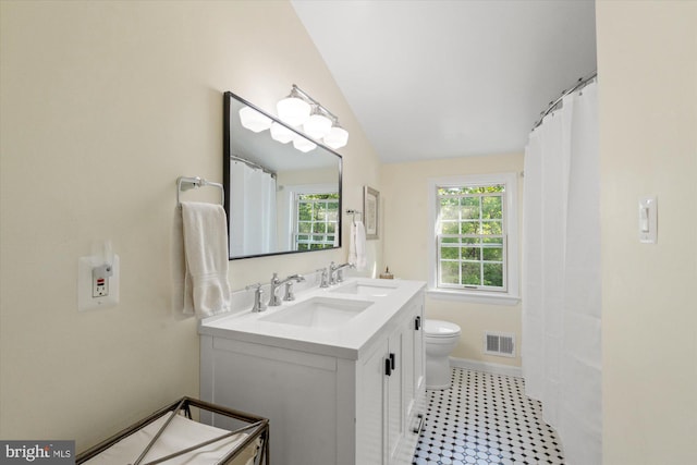 4812 Maury Ln, Alexandria, VA 22304 - bathroom featuring visible vents, a sink, lofted ceiling, and toilet