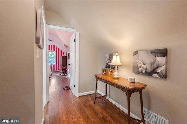 4812 Maury Ln, Alexandria, VA 22304 - hallway featuring visible vents, baseboards, lofted ceiling, and wood finished floors