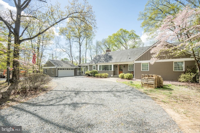 4812 Maury Ln, Alexandria, VA 22304 - ranch-style home with a chimney, an attached garage, an outbuilding, and gravel driveway