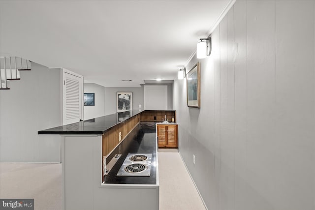 4812 Maury Ln, Alexandria, VA 22304 - kitchen featuring dark countertops, stainless steel electric stovetop, and a decorative wall