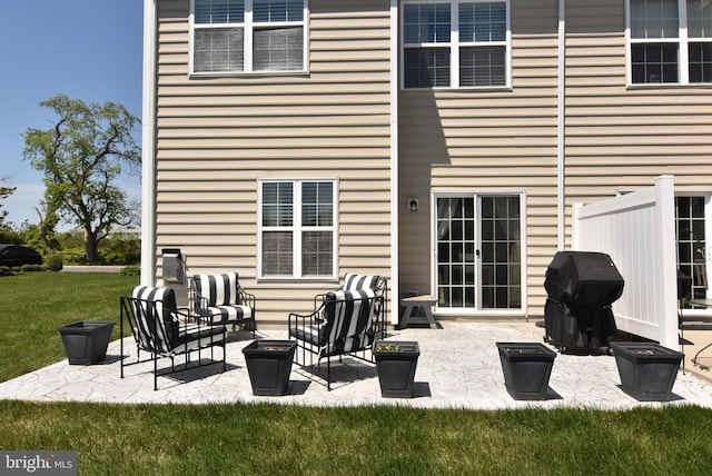 back of property featuring a yard and a patio area