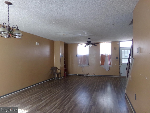 1933 N Palethorp St, Philadelphia, PA 19122 - spare room featuring stairway, ceiling fan with notable chandelier, a textured ceiling, and wood finished floors
