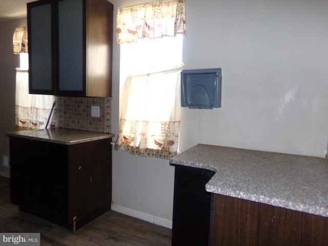 1933 N Palethorp St, Philadelphia, PA 19122 - kitchen with baseboards, light countertops, dark wood-style flooring, and tasteful backsplash