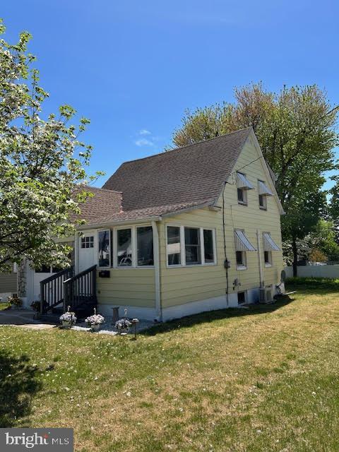 2081 S Olden Ave, Hamilton, NJ 08610 - back of house featuring roof with shingles and a yard