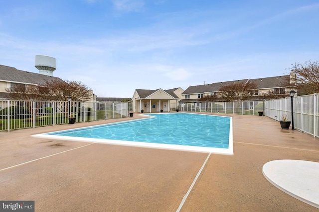view of swimming pool with a patio, fence, and a fenced in pool